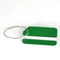 Green aluminum metal luggage tag detail, bag ID name tag with steel wire loop for travel. - Cut Corner Green
