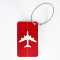 Red aluminum luggage tag with steel wire loop, durable metal suitcase ID card holder label. - Red