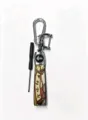 Detail view of the Chinese style metal and leather car keychain pendant with a mini screwdriver. - Golden Rooster Standing on One Leg Puzzle