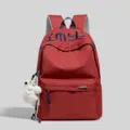 Red college style minimalist letter embroidered backpack with cute plush pendant for daily use. - With Charm / Red