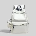 Minimalist college style backpack with cute letter embroidery, lightweight and large capacity for daily use. - With Charm / White
