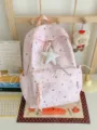 Cute pink star print backpack for women and girls, large capacity casual travel school bag. - With Charm / Pink