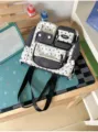 Black and white star patterned canvas backpack casual school bag with multiple front pockets. - Shoulder Bag / Single Bag / Black