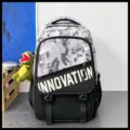 Sac à dos camouflage élégant pour homme, grand sac de voyage et d'école varié. - Avec Pendentif Dinosaure / Camouflage Noir et Gris