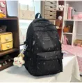 Mochila escolar negra linda con estampado de estrellas, bolsa versátil para estudiantes - Mochila Negra con Colgante