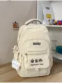Freizeittauglicher Canvas Schulrucksack mit mehreren Fächern und süsser Stickerei - Weiß mit Anhänger