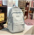 Mochila escolar bonita con estampado de estrellas, variante casual azul claro. - Mochila Azul con Colgante