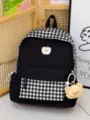 Lässiger schwarz-weißer karierter Schulrucksack mit Apfelstickerei und Bärenanhänger. - Schwarz