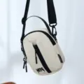 Casual nylon crossbody shoulder bag for women, featuring a mini phone pouch and durable strap. - Off White