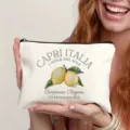 Canvas cosmetic bag featuring Capri Italy lemon print detail and secure zipper closure. - Style 7