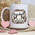 Close-up view of a custom baseball mom ceramic coffee mug featuring leopard print design. - Style 1