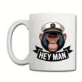 Detail view of a white ceramic coffee mug featuring a cool captain chimpanzee graphic and text. - Style 1