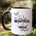 Close-up detail of ceramic coffee mug featuring butterfly graphics and inspirational text design. - 301-400ml / Style 3