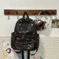 Mochila de lona negra con lunares de colores, bolsillo frontal transparente, casual. - Lunar Negro