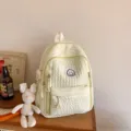 Light yellow sweet style school backpack with cute smiley face badge and soft pleated fabric. - With Pendant / Yellow