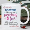 Close-up detail of white ceramic coffee mug featuring doctor appreciation print and ECG heartbeat pattern. - 301-400ml / Style 2