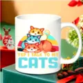 Close-up detail shot of the white ceramic coffee mug featuring cute cat illustration graphic. - Cute Cat