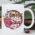 Close-up detail of a white ceramic coffee mug featuring a stylish slogan and graphic print. - Style 10