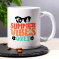 Detailed close-up view of a white ceramic coffee mug featuring summer graphic print design. - Style 10
