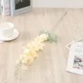 Detailed view of artificial yellow delphinium silk flower branch for home decor and wedding. - Champagne