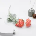 Three-headed flocked ranunculus artificial flower detail shot, perfect for wedding decor. - Pink