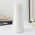 Detail view of white geometric plastic vase, Nordic minimalist desktop decor accessory. - Slender Waist Vase White