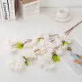 Artificial white cherry blossom branch for home decor, wedding and interior decoration details. - White