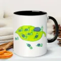 Close-up detail of a ceramic coffee mug featuring a cute cartoon snail leaf art design on desk. - Cartoon Snail Style