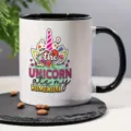Close-up detail of a ceramic mug featuring a colorful unicorn graphic and fun typography. - Unicorn Style