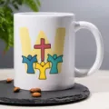 White ceramic coffee mug with religious cross graphic design, perfect for office and daily use. - 2