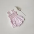 Infant pink checkered smocked romper detailed view with cute ruffles and convenient snaps. - 66cm / Light Pink Stripes