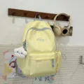 Mochila escolar de lona amarillo claro casual lindo estudiante mochila con colgante de nube - Amarillo + Estrella Enojada