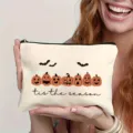 Halloween pumpkin print cosmetic bag detail view, casual canvas makeup pouch with zipper. - Style 2