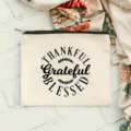 Trousse de maquillage blanche en toile avec fermeture éclair et citation inspirante. - Impression Slogan Action de Grâce / 22x16cm / Blanc