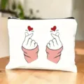 Canvas cosmetic bag detail, cute finger heart print, neat zipper closure and smooth fabric. - Style 4