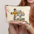 Detailed shot of canvas makeup bag featuring inspiring cross and sunflower print design. - Style 9
