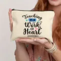 Close-up detail shot of a canvas makeup bag featuring teacher theme quote print and zipper. - Style 12
