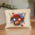 Detailed view of canvas cosmetic makeup bag featuring cute patriotic Highland cow print design. - Style 15