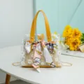 Clear jelly tote bag with straw inner bag, yellow PU handles, and stylish printed scarf. - Yellow
