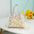 Transparent PVC straw tote bag with daisy floral print, pink handles and chain strap. - Pink