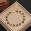 Luxury titanium steel clover bracelet with black zircon stones, elegant gold jewelry piece. - Gold Black Zirconia