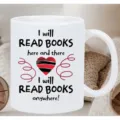 Detailed shot of white ceramic coffee mug with book lover typography and red heart print. - 10