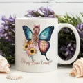 White ceramic coffee mug featuring beautiful butterfly fairy graphic and inspirational text. - Butterfly Fairy Print