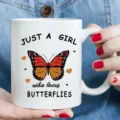 White ceramic coffee mug with butterfly print and inspirational quote, ideal for office and home use. - Butterfly Illustration Style