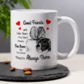 Close-up detail of white ceramic coffee mug featuring heartwarming friendship illustration. - Good Friends Illustration Style
