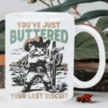 Close-up of a funny cowboy cat ceramic mug, cute western graphic detail for coffee lovers. - Cowboy Cat Style