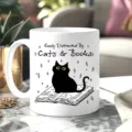Detailed view of white ceramic coffee mug with cute cat and book illustration and quote. - Cats and Books Style