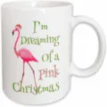 Detailed closeup view of a white ceramic coffee mug featuring festive flamingo graphic. - Style 9