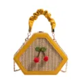 Sac bandoulière en paille chic pour femme avec joli décor de cerise et poignée plissée élégante. - Jaune