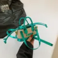 Mini straw handbag with metallic green colorblock trim, cute top handle crossbody bag. - Green